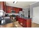 Modern kitchen with stainless steel appliances, an island, and plenty of counter space at 3101 Woodhaven Way, Bargersville, IN 46106
