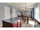 Bright kitchen featuring an island, dining area, and an open layout to a living space at 3101 Woodhaven Way, Bargersville, IN 46106