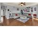 Spacious living room boasting hardwood floors, a gray sofa, and stylish decor throughout the area at 3101 Woodhaven Way, Bargersville, IN 46106