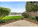 Lush backyard overlooking a serene lake at 3113 Sandpiper N Dr, Indianapolis, IN 46268