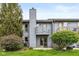 Back of home with small balcony overlooking a lush green yard at 3113 Sandpiper N Dr, Indianapolis, IN 46268
