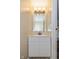 Powder room with white vanity, a stylish mirror and three-bulb vanity light at 3113 Sandpiper N Dr, Indianapolis, IN 46268