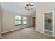 Bright bedroom with large windows, plush carpet, and modern lighting for a comfortable ambiance at 3113 Sandpiper N Dr, Indianapolis, IN 46268