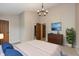 Well-lit bedroom featuring plush carpeting, ample closet space, and neutral décor at 3113 Sandpiper N Dr, Indianapolis, IN 46268
