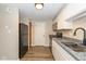 Efficient kitchen with sleek appliances, granite countertops, and ample cabinet space at 3113 Sandpiper N Dr, Indianapolis, IN 46268
