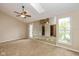 Bright main bedroom with skylight, view of pond, mirrored wall and door to private balcony at 3113 Sandpiper N Dr, Indianapolis, IN 46268
