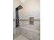 Elegant shower with dual shower heads and a convenient built-in bench for ultimate relaxation at 3113 Sandpiper N Dr, Indianapolis, IN 46268