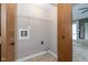 Cozy utility room with wire shelf and dark wood door at 3113 Sandpiper N Dr, Indianapolis, IN 46268