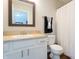 Clean bathroom featuring a single vanity, modern faucet, and shower with curtain at 3367 Rolling Knoll Ln, Columbus, IN 47201