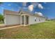 This home boasts a cozy covered porch and well-maintained landscaping on a verdant lawn at 3367 Rolling Knoll Ln, Columbus, IN 47201