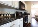 Well-lit kitchen with black appliances, ample counter space, and white cabinets at 3367 Rolling Knoll Ln, Columbus, IN 47201