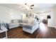 Comfortable living room with a large sectional sofa, ceiling fan, and open access to kitchen at 3367 Rolling Knoll Ln, Columbus, IN 47201