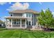 Exterior view of home featuring covered patio and spacious backyard at 3561 Shady Lk Dr, Westfield, IN 46074