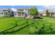 A picturesque backyard with a manicured lawn and patio seating, perfect for relaxation and outdoor entertainment at 3561 Shady Lk Dr, Westfield, IN 46074