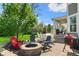 Inviting outdoor patio with a cozy fire pit, comfortable seating, and a picturesque view of the backyard at 3561 Shady Lk Dr, Westfield, IN 46074