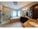 This spa-like bathroom offers a tiled shower and separate soaking tub, ideal for unwinding after a long day at 3561 Shady Lk Dr, Westfield, IN 46074