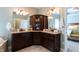 Stunning ensuite bathroom with granite counters, double sinks, and seamless access to the main bedroom at 3561 Shady Lk Dr, Westfield, IN 46074
