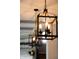 Close-up of a modern iron chandelier hanging in a home at 3561 Shady Lk Dr, Westfield, IN 46074