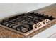 Close up of a modern Frigidaire stainless steel cooktop installed in granite countertops at 3561 Shady Lk Dr, Westfield, IN 46074
