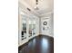 Open entry offers french doors, hardwood floors, and a view of the front door with transom window at 3561 Shady Lk Dr, Westfield, IN 46074