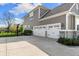 Traditional two story home with a three-car garage, a basketball hoop, and a driveway at 3561 Shady Lk Dr, Westfield, IN 46074
