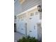 Attached two car garage featuring white doors with black hardware and stone supports for a timeless design at 3561 Shady Lk Dr, Westfield, IN 46074