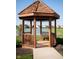 Wooden gazebo overlooking a serene lake offers a tranquil retreat at 3561 Shady Lk Dr, Westfield, IN 46074