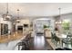 Open-concept kitchen featuring a breakfast bar that connects to a breakfast nook with abundant light at 3561 Shady Lk Dr, Westfield, IN 46074