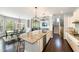Large kitchen with a granite island, stainless steel appliances, and coffered ceilings at 3561 Shady Lk Dr, Westfield, IN 46074