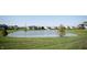 A tranquil lake in the community, features a fountain and lush green lawns at 3561 Shady Lk Dr, Westfield, IN 46074
