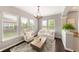 Bright living room with a neutral color palette, hardwood floors, and large windows overlooking the neighborhood at 3561 Shady Lk Dr, Westfield, IN 46074