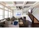 Bright living room with coffered ceilings, fireplace, and dark hardwood floors at 3561 Shady Lk Dr, Westfield, IN 46074