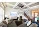Cozy living room with a fireplace, staircase, and coffered ceilings at 3561 Shady Lk Dr, Westfield, IN 46074