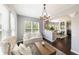 Inviting living room featuring abundant natural light and seamless flow into the dining area at 3561 Shady Lk Dr, Westfield, IN 46074