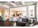 Open-concept living room with hardwood floors and a modern sectional sofa at 3561 Shady Lk Dr, Westfield, IN 46074