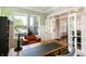 Bright office with large windows, a leather chair, and a view into the front entry at 3561 Shady Lk Dr, Westfield, IN 46074