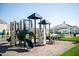 Community playground features multiple slides and climbing areas adjacent to a covered picnic area at 3561 Shady Lk Dr, Westfield, IN 46074