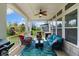 Back porch with ceiling fan, seating, grill and nice view of the backyard play set and neighborhood at 3561 Shady Lk Dr, Westfield, IN 46074