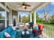 Inviting covered patio with outdoor seating, ceiling fan, and grill, perfect for enjoying the outdoors at 3561 Shady Lk Dr, Westfield, IN 46074