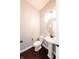 Clean powder room featuring a pedestal sink, modern fixtures, and stylish finishes at 3561 Shady Lk Dr, Westfield, IN 46074
