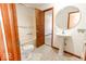 Bathroom with pedestal sink, toilet and a tub shower at 3948 S Woodfield Dr, New Palestine, IN 46163