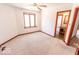 Bright bedroom with a window, plush carpet, and en-suite bathroom access, offering comfort and privacy at 3948 S Woodfield Dr, New Palestine, IN 46163