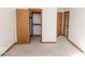 Bedroom featuring neutral carpet, a walk-in closet, and an en-suite bathroom at 3948 S Woodfield Dr, New Palestine, IN 46163