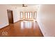 Bright bedroom featuring a ceiling fan, hardwood floors and natural light at 3948 S Woodfield Dr, New Palestine, IN 46163