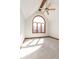 Bright bedroom with a large arched window, ceiling fan and neutral carpeting at 3948 S Woodfield Dr, New Palestine, IN 46163