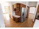 Kitchenette with stainless steel refrigerator and oven and wooden cabinets at 3948 S Woodfield Dr, New Palestine, IN 46163