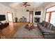 Contemporary living room with sleek furniture, modern décor, and a cozy fireplace feature at 3948 S Woodfield Dr, New Palestine, IN 46163