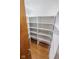 Walk-in pantry featuring open shelving for organized storage and easy access to your items at 3948 S Woodfield Dr, New Palestine, IN 46163