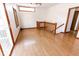 Bright landing area with hardwood floors and access to the outside deck at 3948 S Woodfield Dr, New Palestine, IN 46163