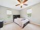 Bedroom featuring neutral paint, carpet, and a queen bed at 4079 S 50 W, Anderson, IN 46013